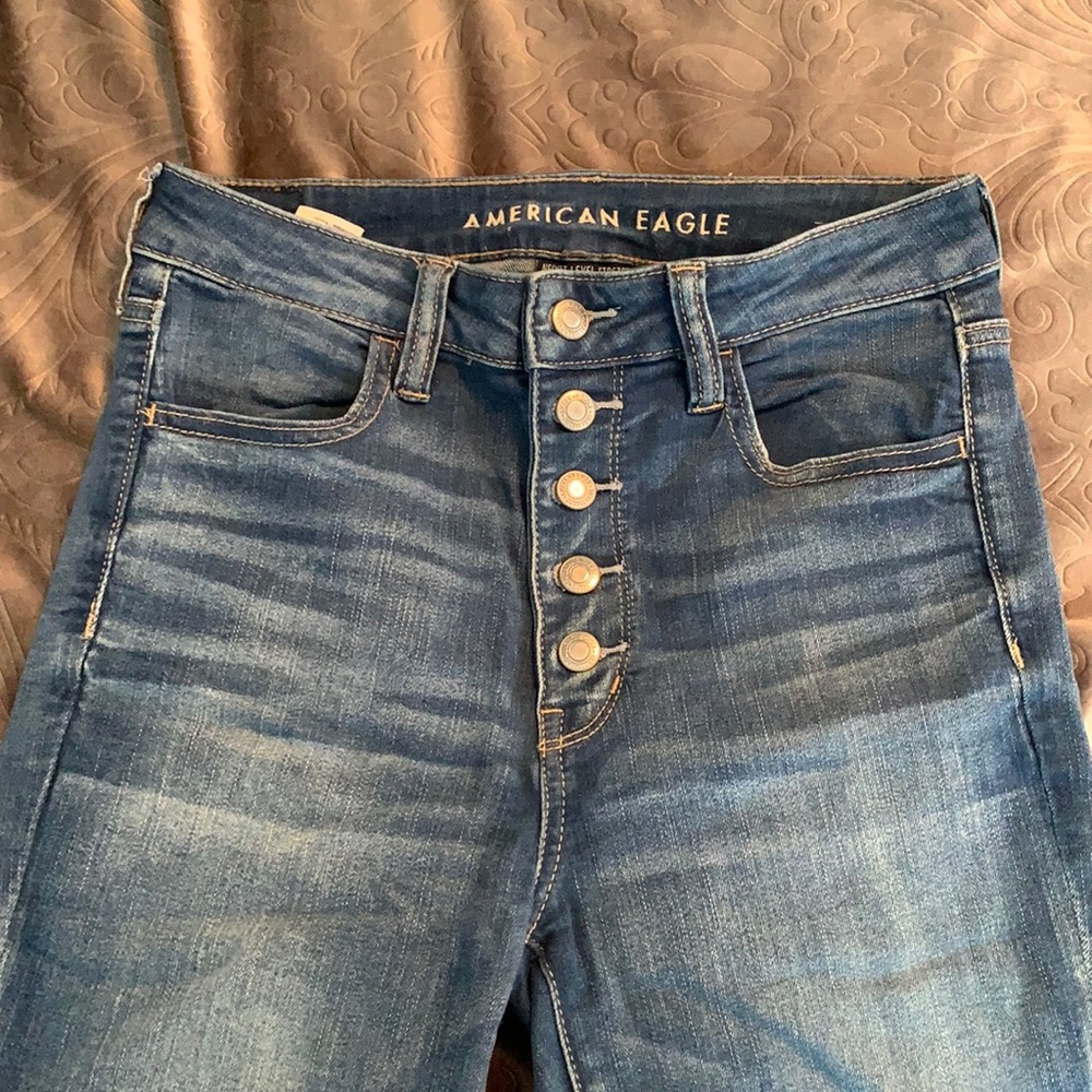 American Eagle Ne(x)t level stretch high waited button up skinny Jean.